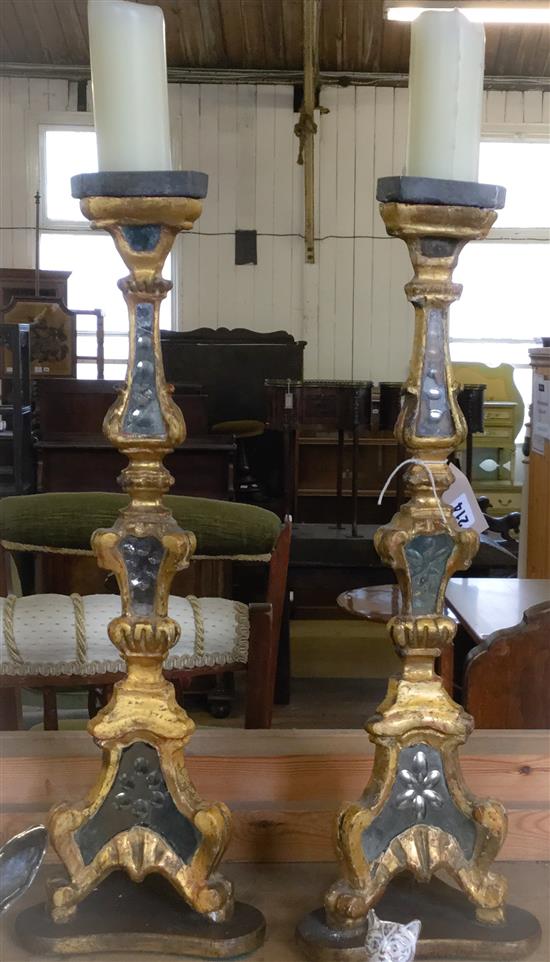 Pair of mirrored and giltwood candlesticks